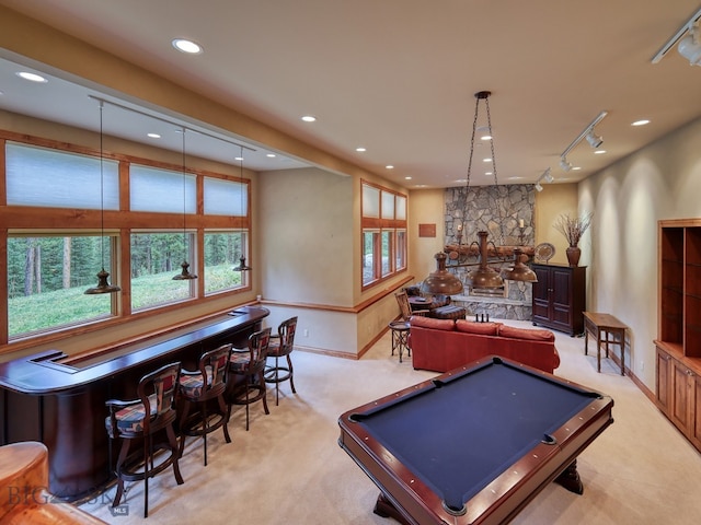 game room with pool table and light carpet