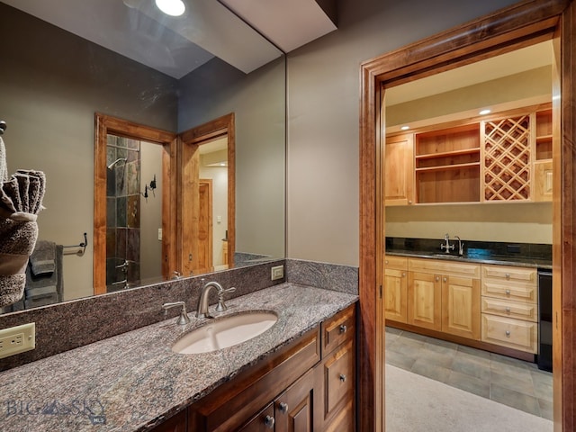 bathroom featuring vanity and a shower