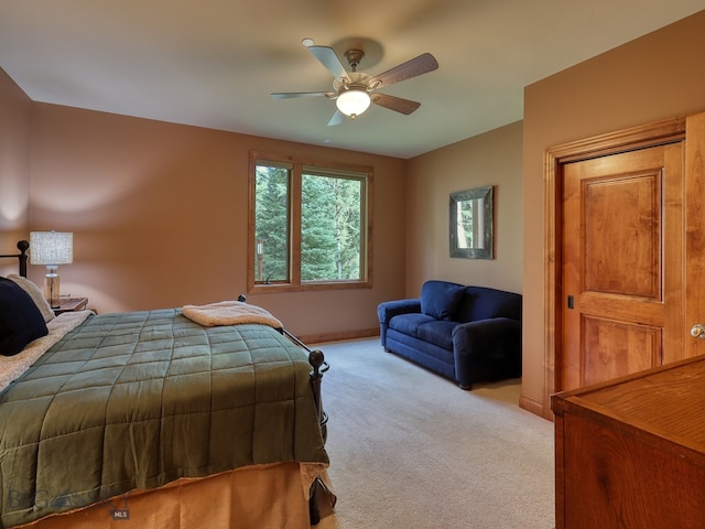 bedroom with light carpet and ceiling fan