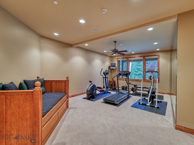 workout area featuring light carpet and ceiling fan