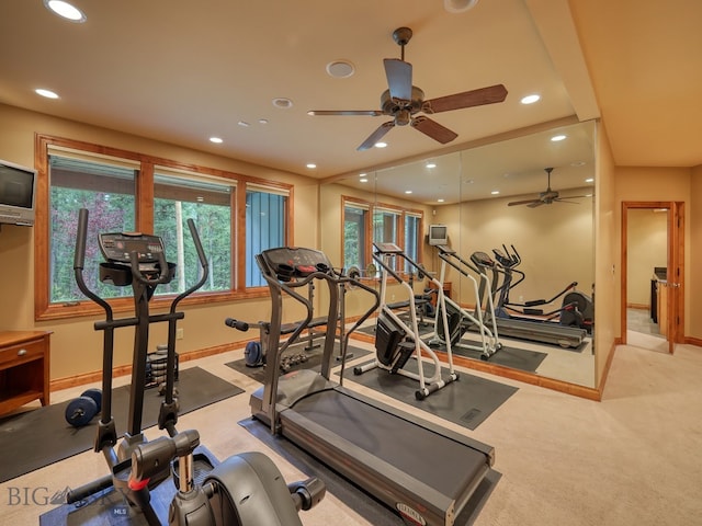 interior space featuring light carpet and ceiling fan