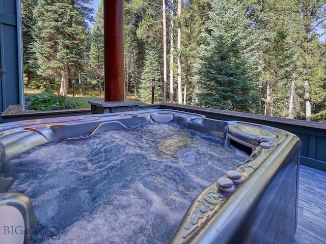 3686 Pinewood Dr, Big Sky, MT 59716 - exterior view of a jacuzzi and a heavily wooded area