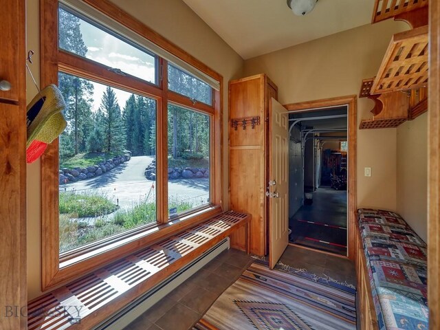 3686 Pinewood Dr, Big Sky, MT 59716 - doorway featuring baseboard heating and tile patterned floors