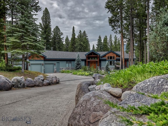 3686 Pinewood Dr, Big Sky, MT 59716 - view of front of property featuring a garage and driveway