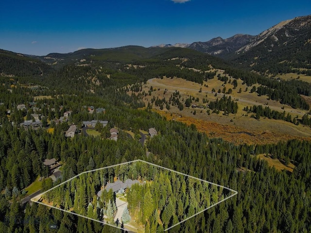 3686 Pinewood Dr, Big Sky, MT 59716 - aerial overview of property's location with a mountain backdrop and property boundaries highlighted