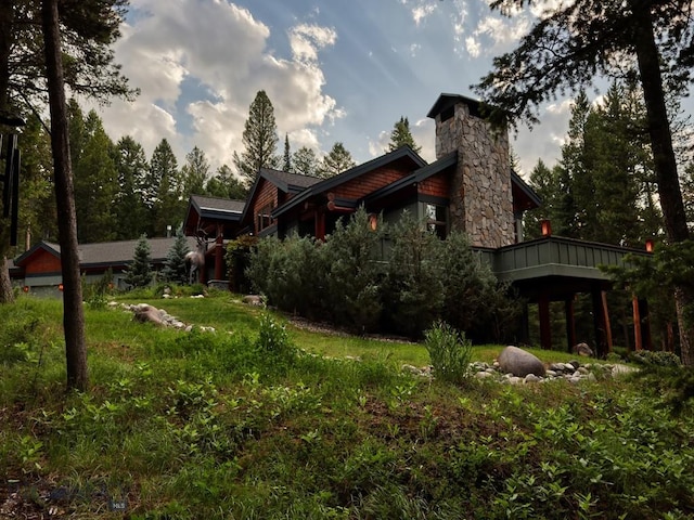 3686 Pinewood Dr, Big Sky, MT 59716 - back of house with a chimney
