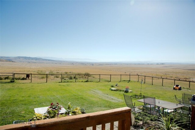 view of yard featuring a mountain view and a rural view