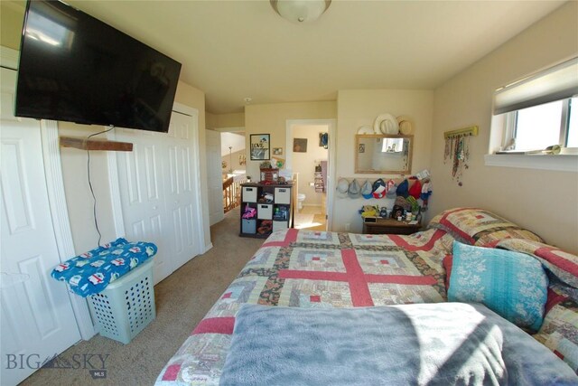 bedroom featuring light colored carpet and lofted ceiling