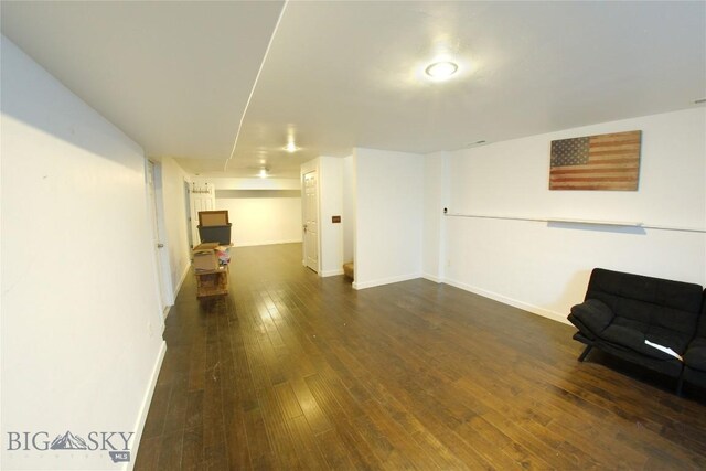 basement with dark wood-type flooring