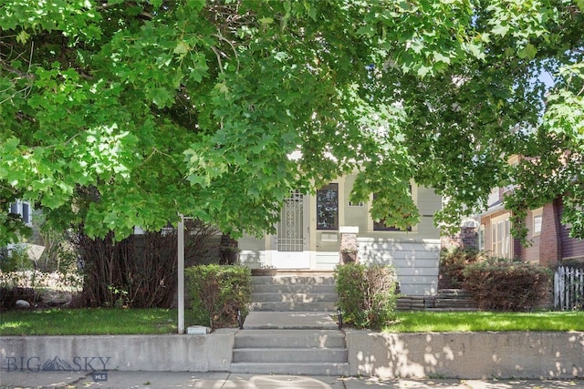 view of property hidden behind natural elements