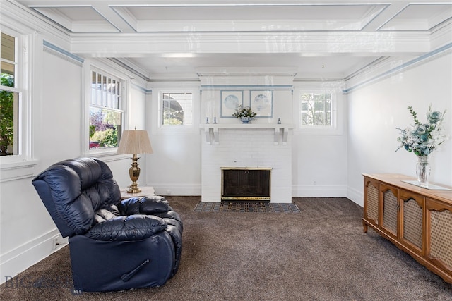 carpeted living room featuring ornamental molding, coffered ceiling, plenty of natural light, and a fireplace