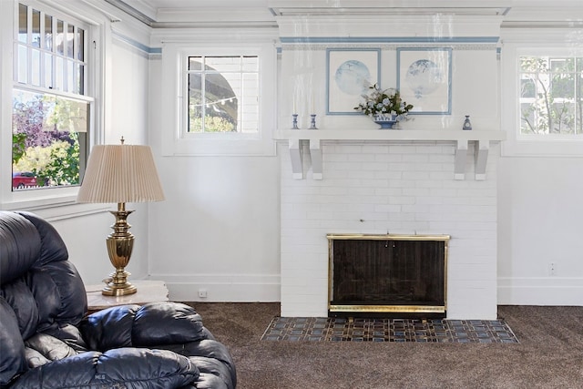 living room with dark carpet, a brick fireplace, a wealth of natural light, and crown molding