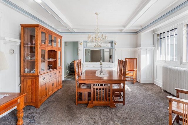 dining room featuring crown molding, radiator heating unit, dark colored carpet, and beamed ceiling