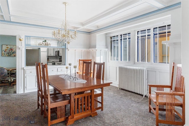 carpeted dining space with radiator, beamed ceiling, a chandelier, coffered ceiling, and crown molding