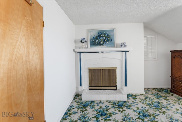 details featuring a brick fireplace, carpet, and a textured ceiling