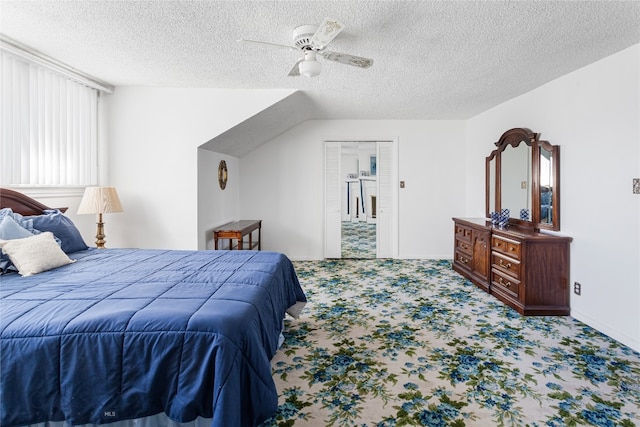 bedroom featuring a closet, carpet, ceiling fan, and a textured ceiling