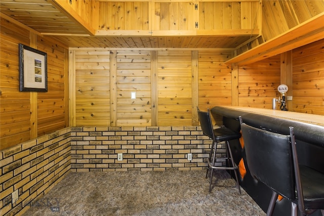 carpeted office with wood walls