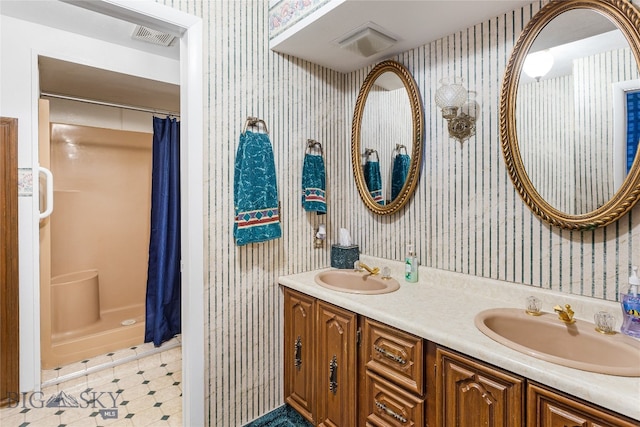 bathroom with vanity and curtained shower