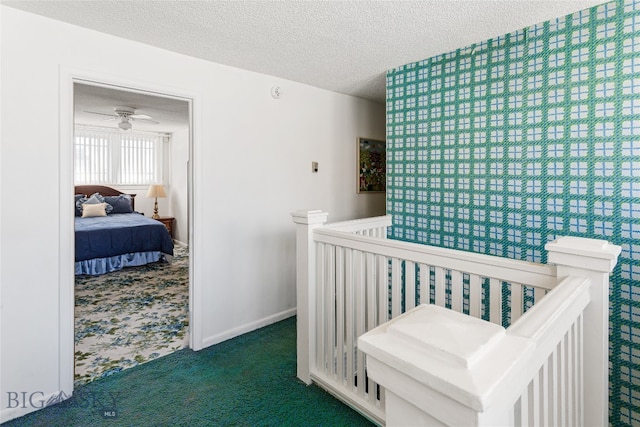 carpeted bedroom with a textured ceiling