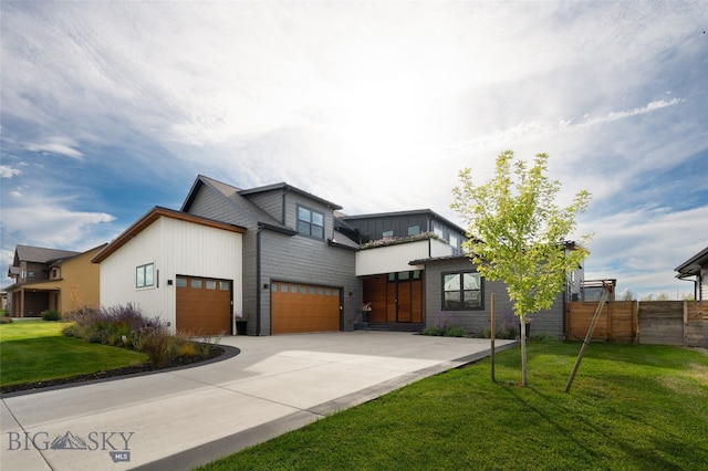 exterior space featuring a garage and a lawn