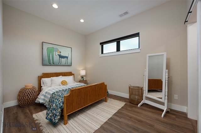 bedroom featuring dark hardwood / wood-style floors