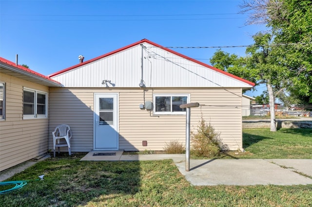 rear view of house with a lawn