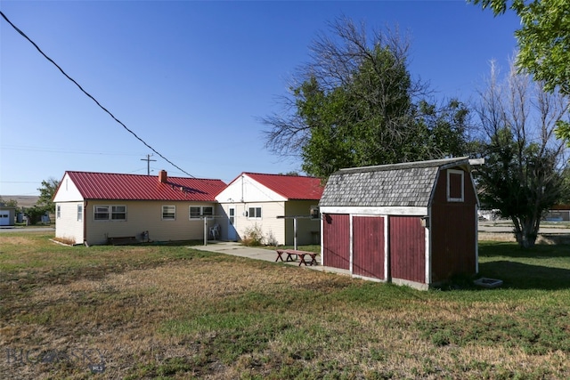 view of yard featuring a shed and a patio area