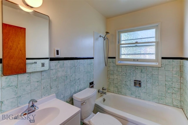 1112 Pritchard NW, Harlowton, MT 59036 - bathroom with tile walls, bathtub / shower combination, toilet, vanity, and wainscoting