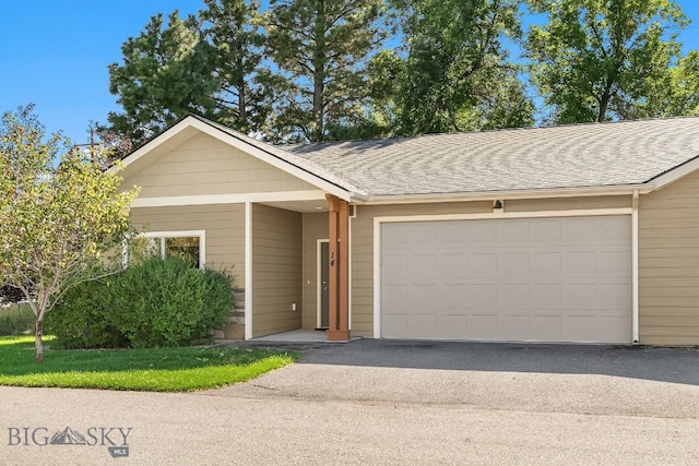 ranch-style home featuring a garage