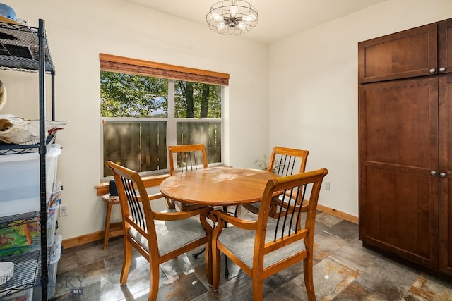 dining space with a notable chandelier