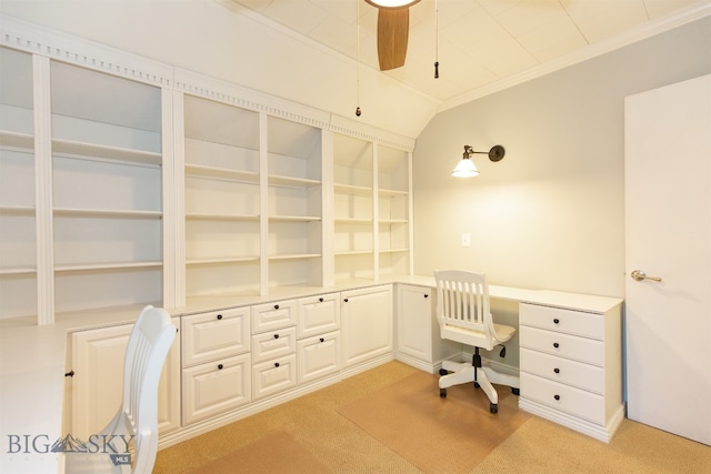 office area with light carpet, built in desk, ornamental molding, and ceiling fan