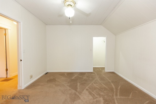 additional living space with carpet flooring, vaulted ceiling, and ceiling fan