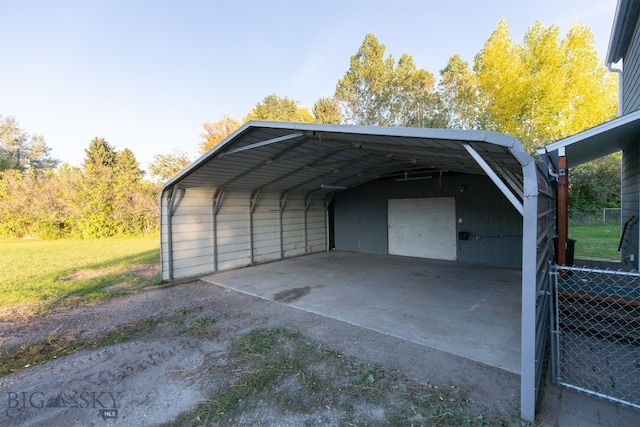 view of parking with a lawn and a carport