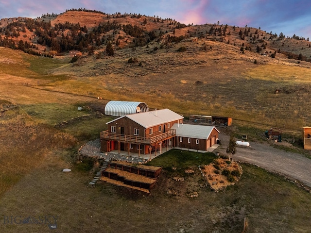 aerial view at dusk with a mountain view