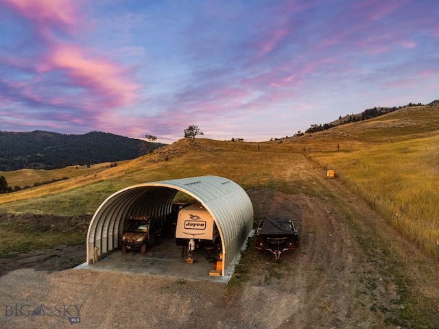 31 Bull Run Rd, Livingston, MT 59047 - exterior space with a rural view, dirt driveway, a carport, and a mountain view