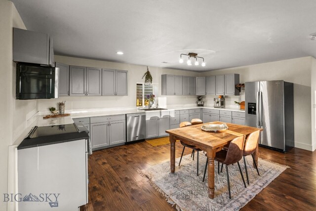 31 Bull Run Rd, Livingston, MT 59047 - kitchen with stainless steel appliances, dark wood-style floors, a sink, recessed lighting, and gray cabinets