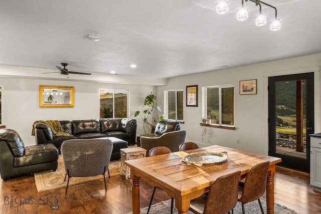 dining room with dark hardwood / wood-style flooring and ceiling fan