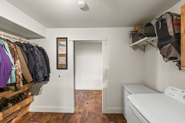 laundry area featuring washer / clothes dryer and dark wood-type flooring