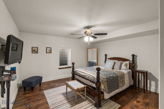 bedroom with ceiling fan and dark wood-type flooring