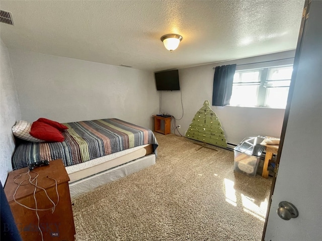 bedroom with carpet floors, a textured ceiling, and a baseboard radiator