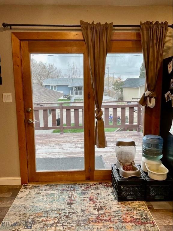 1115 E Center St, Dillon, MT 59725 - doorway featuring wood finished floors and baseboards