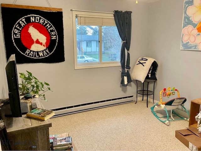 interior space featuring carpet and a baseboard heating unit