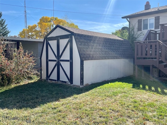 view of outdoor structure with a lawn