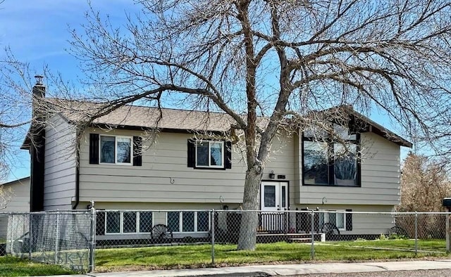 1115 E Center St, Dillon, MT 59725 - view of front of house featuring a fenced front yard and a chimney