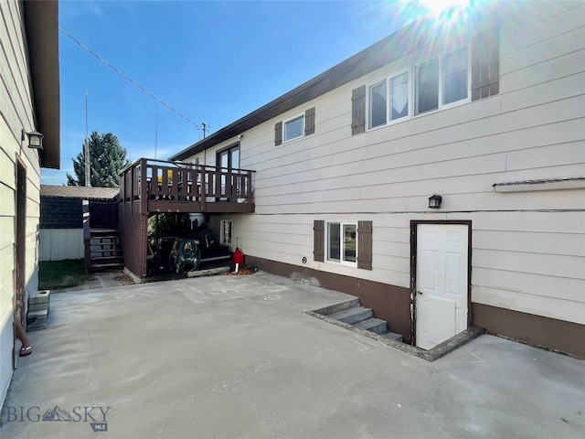 exterior space with a deck and a patio area