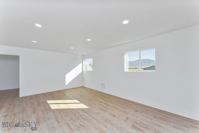 unfurnished room featuring light wood-type flooring