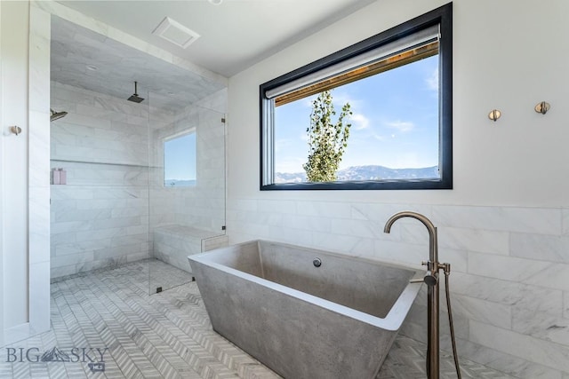500 Stubbs Ln, Bozeman, MT 59718 - bathroom featuring a freestanding bath, tiled shower, and tile patterned floors