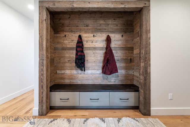 mudroom with light hardwood / wood-style floors