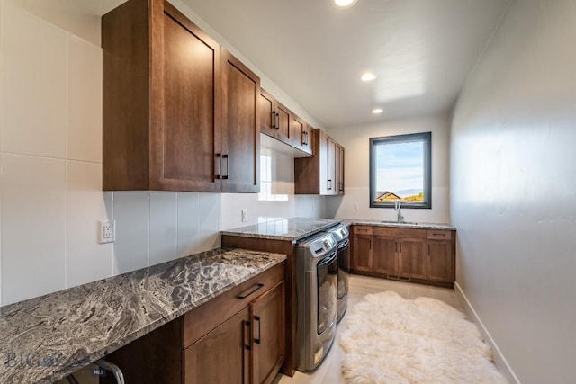 500 Stubbs Ln, Bozeman, MT 59718 - kitchen featuring dark stone counters and recessed lighting