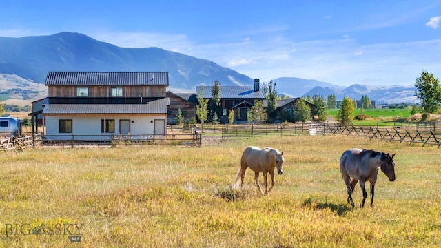 mountain view featuring a rural view